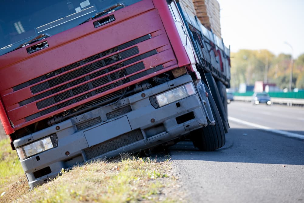 Truck accident due to lost control, left interstate road and plunges into ditch