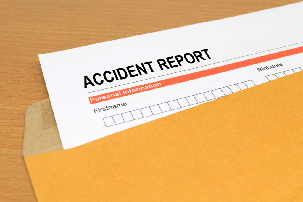 Accident report form on brown envelope to claim insurance for injuries in accident on oil rig